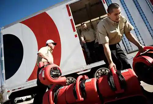 loading water removal equipment into BELFOR trucks