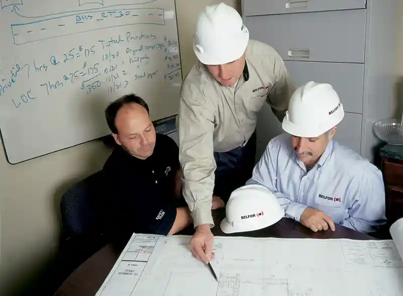 BELFOR contractors review site plans and blueprints